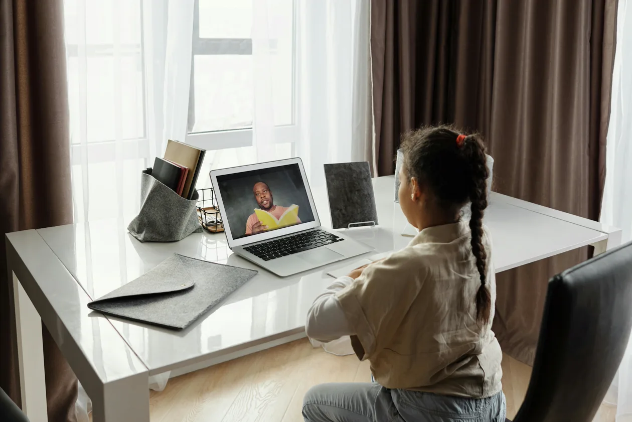 Student learning math one-on-one over Zoom